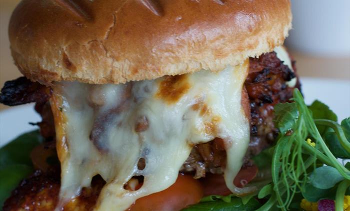 Our signature pulled pork, mozzarella beef burger